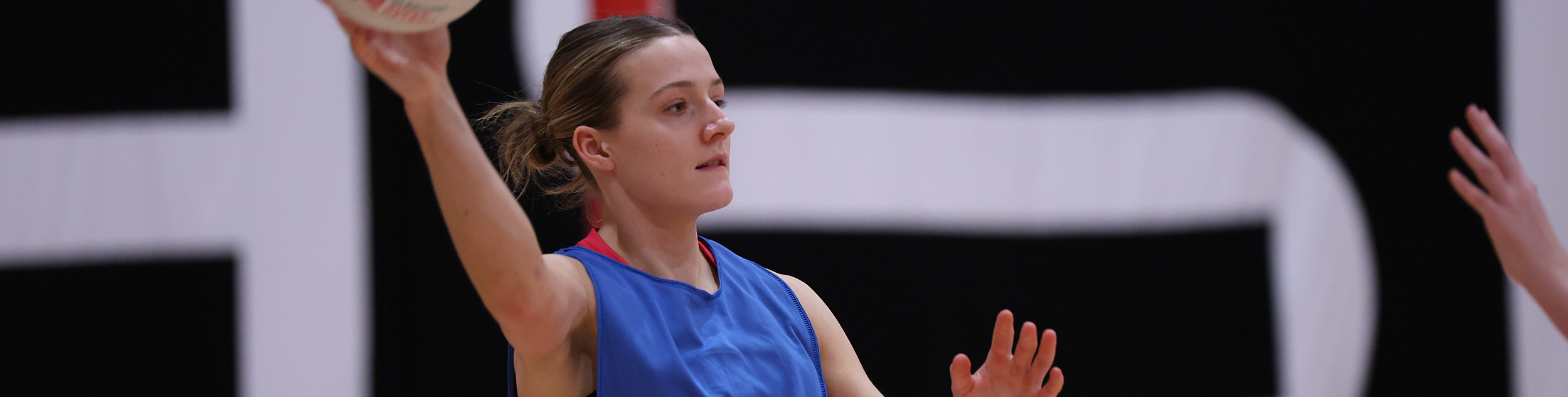 Lucy Voyvodic with a netball in her hand