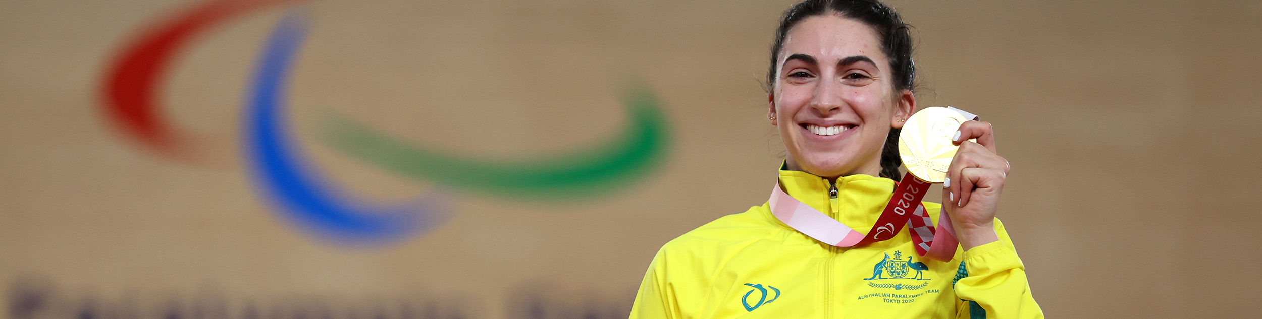 Paige Greco holds the Paralympic gold medal