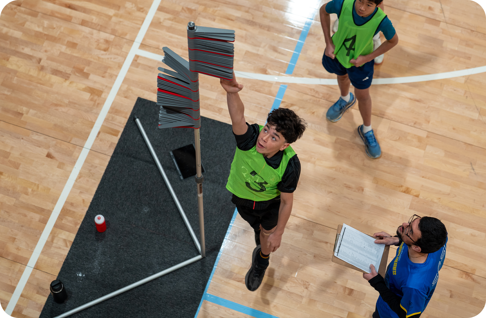 Student performing a vertical jump at a Discovering Greatness session