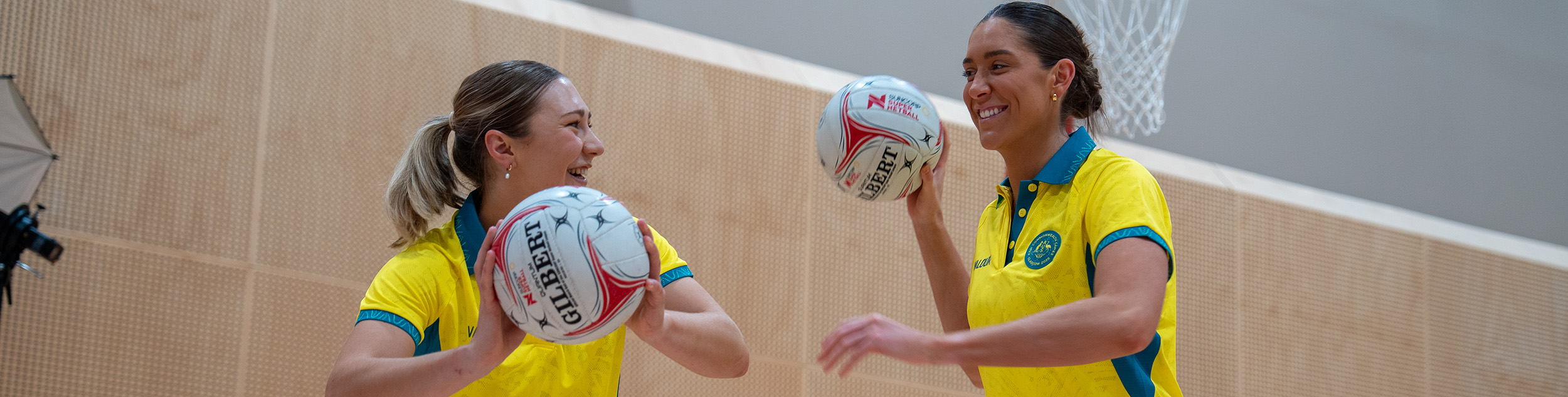 Georgie Horjus and Matilda Garrett holding netballs